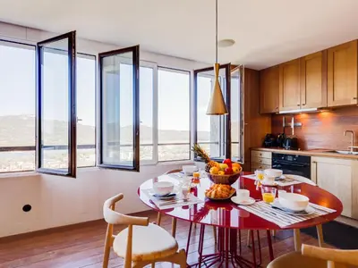 a kitchen with a table with a bowl of fruit on it at Apartment La Porte Génoise by Interhome in Porto-Vecchio