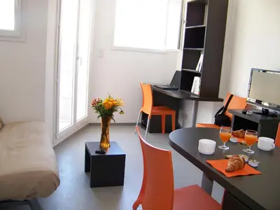 a small office with a desk and a table with a computer at Vanina Park in Corte