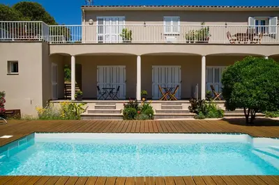 a house with a swimming pool in front of a house at I Casilari in Serra-di-Ferro