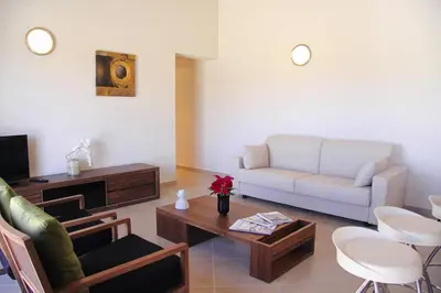 a living room with a couch and a table at Apartment in Corsica near Palombaggia Beach in Porto-Vecchio