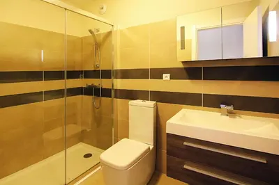 a bathroom with a toilet and a sink and a shower at Apartment in Corsica near Palombaggia Beach in Porto-Vecchio
