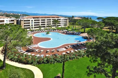 an aerial view of a resort with a pool and chairs at Apartment in Corsica near Palombaggia Beach in Porto-Vecchio