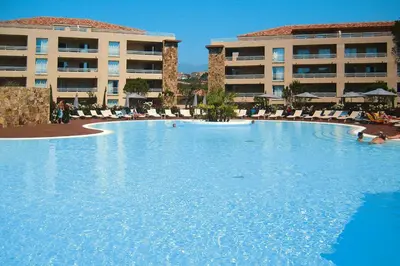 a large swimming pool in front of a hotel at Apartment in Corsica near Palombaggia Beach in Porto-Vecchio