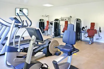 a gym with treadmills and elliptical machines at Residence Salina Bay, Porto Vecchio, Apartment garden side in Porto-Vecchio
