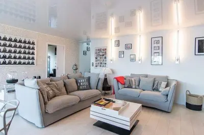 a living room with two couches and a table at Maison 
