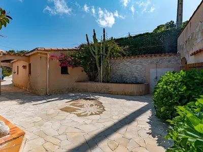 a stone patio with a star on it at Holiday Home Campestra by Interhome in Coti-Chiavari