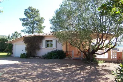 a small house with a tree in front of it at CELESTE in Capo