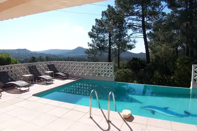 a swimming pool with a view of the mountains at CELESTE in Capo