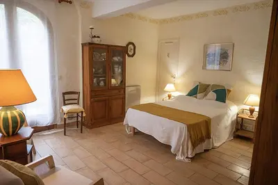 a bedroom with a large bed and a window at Grande Villa, Corse du Sud, Domaine privé de Cala Rossa in Porto-Vecchio