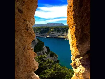a view of a lake from a window at Grande Villa, Corse du Sud, Domaine privé de Cala Rossa in Porto-Vecchio