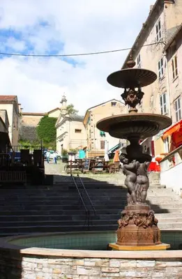 a water fountain in front of some stairs at Corté Centre Corse in Corte