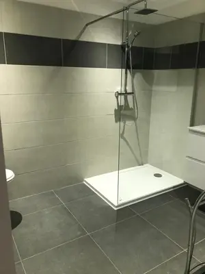 a shower with a glass door in a bathroom at Corté Centre Corse in Corte