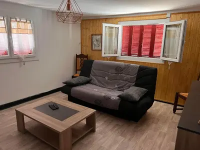 a living room with a couch and a coffee table at Bottega in Petreto-Bicchisano