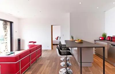 a kitchen with a table and chairs in a room at Domaine Valle Doniche in Olmeto