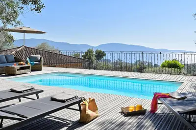 a swimming pool with a view of the mountains at Domaine Valle Doniche in Olmeto