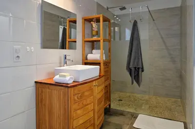 a bathroom with a sink and a mirror at Domaine Valle Doniche in Olmeto