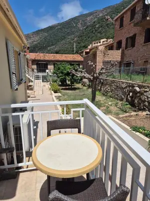 a table and chairs on a balcony with a view at Résidence Idéal-Subrini in Porto Ota