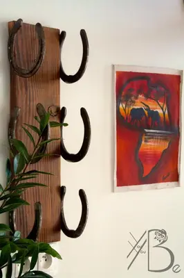 a cactus hanging on a wall next to a painting at residence de porticcio, youyoube in Porticcio