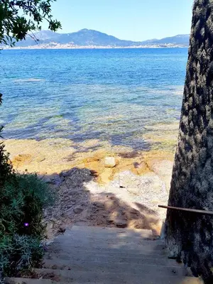 a view of the ocean from a path near the water at residence de porticcio, youyoube in Porticcio