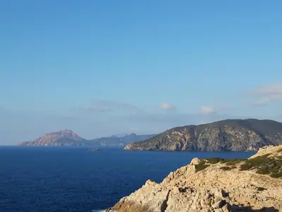 a view of a large body of water with mountains at Maison de Vacances Renno in Renno