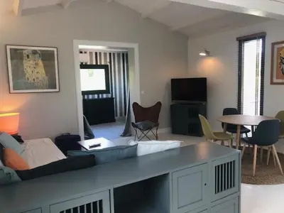 a living room with a couch and a table at Oliera 2 in Oletta