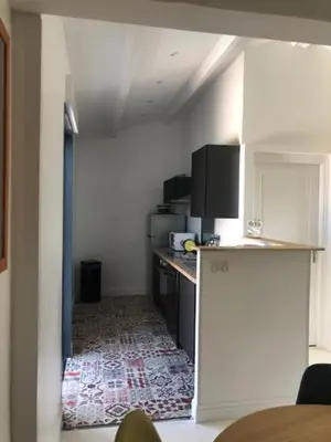 a room with a kitchen with a counter and a counter top at Oliera 2 in Oletta