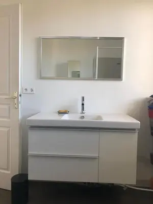 a bathroom with a white sink and a mirror at Oliera 2 in Oletta