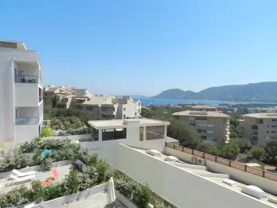 a swimming pool in front of a building at Studio Château-11 by Interhome in Porto-Vecchio