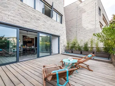 two chairs and a table on a wooden deck at Apartment Bastion-3 by Interhome in Porto-Vecchio