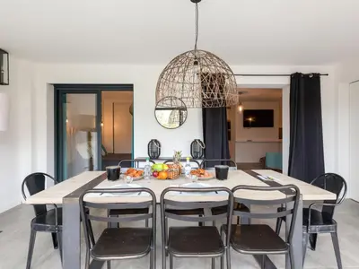 a bedroom with a large bed and a balcony at Apartment Bastion-3 by Interhome in Porto-Vecchio