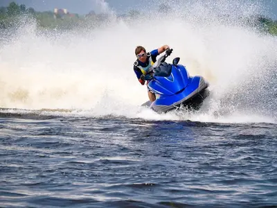 a man riding a jet ski in the water at Camping Le Sagone in Sagone
