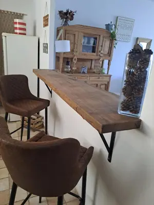 a kitchen with a wooden table and two chairs at Casa tanghicciola in Levie