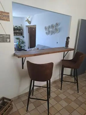 a table and two chairs in a room at Casa tanghicciola in Levie