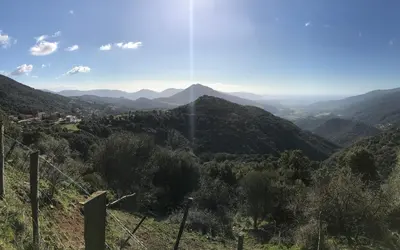 a view of a valley with mountains in the distance at Charmante maison de village *** in Santa-Maria-Figaniella