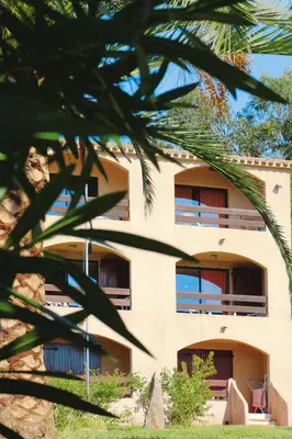 a building with balconies on the side of it at Apartment in Corsica near Liscia Beach in Casaglione