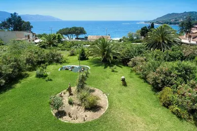 a garden with a small tree in the grass at Apartment in Corsica near Liscia Beach in Casaglione