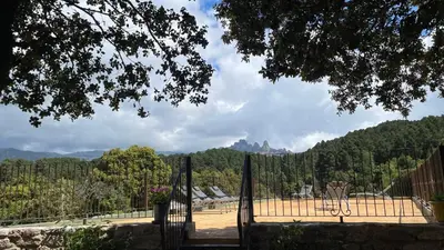 a fence with a view of a tennis court at Les Hauts de Cavanello in Zonza