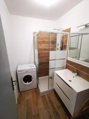 a bathroom with a washing machine and a washer at Casa Padulella in Moriani Plage