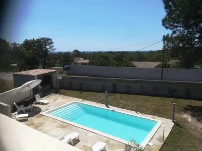a swimming pool on the roof of a house at Chambre d'hôte l'Escale in Sainte-Lucie de Porto-Vecchio