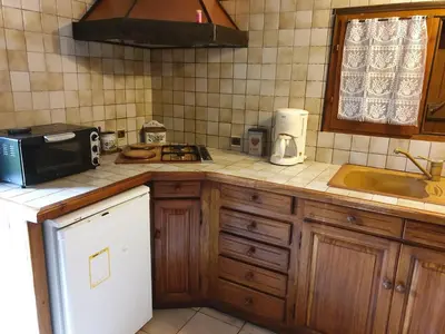 a kitchen with a sink and a microwave on a counter at STUDIO avec Mezzanine in Corte