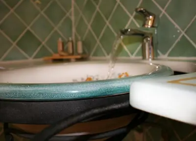 a bathroom with a bath tub with a water fountain at Aux Bords du Temps in Zonza