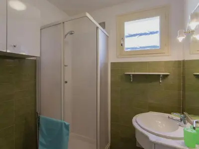 a bathroom with a shower and a sink at Romantic Retreat in Cargèse in Cargèse