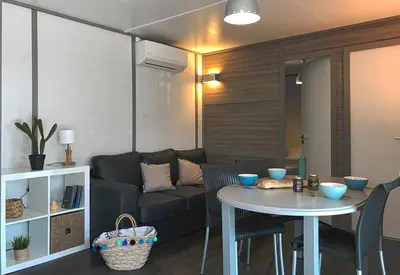 a living room with a couch and a table at U FARNIENTE in Bonifacio