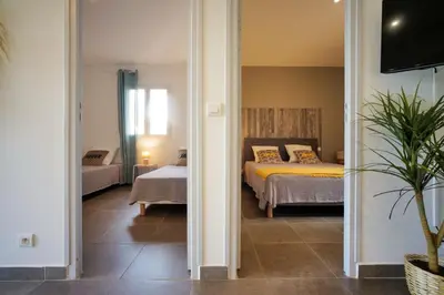 a bedroom with a bed and a room with a bed at SOLE DI DUME in Sotta
