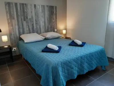 a bed with two towels on top of it at SOLE DI DUME in Sotta