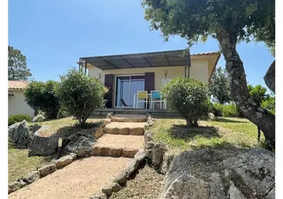 a home with a stone path leading to a house at SOLE DI DUME in Sotta