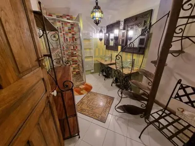 a room with a wooden door and a table and a tableasteryasteryasteryastery at mare-monte in Evisa