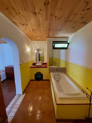 a large bathroom with a tub and a sink at Residence VILLA MOROSI - Favone in Conca