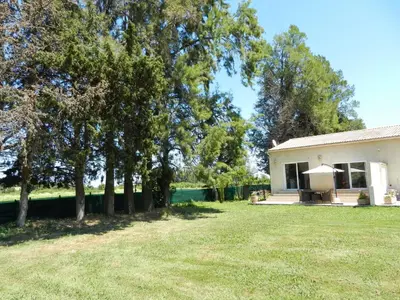 a white house with trees in the yard at Monica di Sorbo in Sorbo-Ocagnano