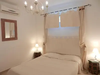 a bedroom with two beds and a window at Monica di Sorbo in Sorbo-Ocagnano